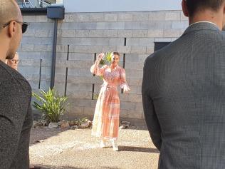 Queensland's only female auctioneer Tara Kelly in action this morning