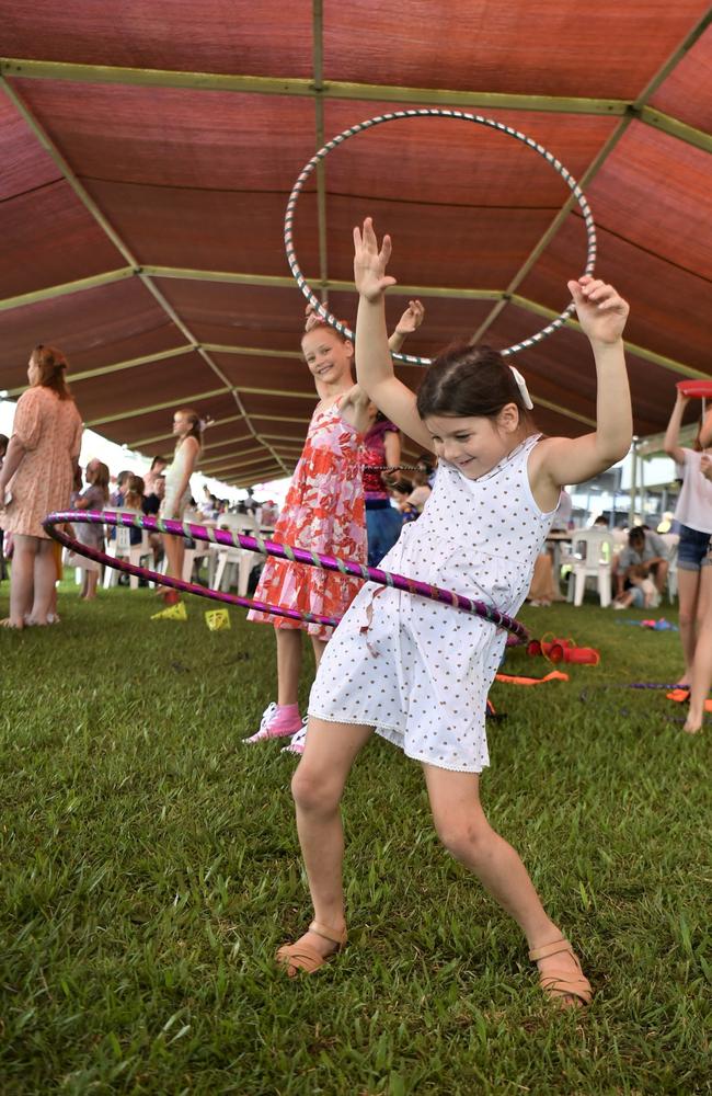 Eva Tynan, 7, front, and Willa Chadbourne, 9, show off their circus tricks at the Chief Minister's Cup Day at the Darwin Turf Club on Saturday, July 15.