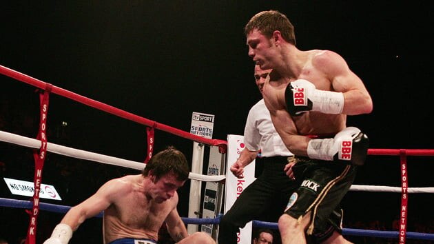 Michael Katsidis drops Graham Earl during their world title fight in 2007.