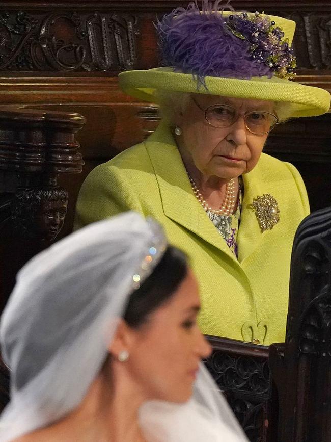 Britain's Queen Elizabeth II looks on at Meghan Markle. Picture: AFP