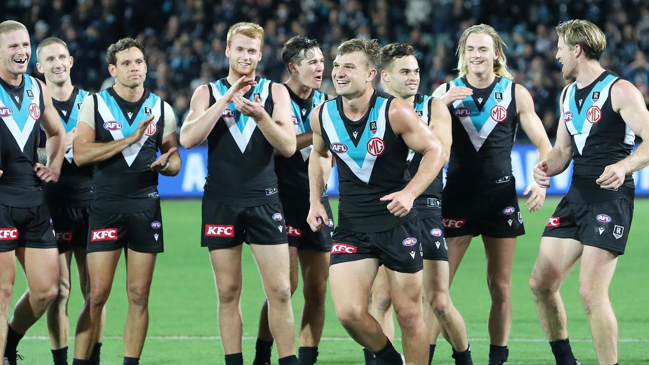 A beaming Ollie Wines after being named as the winner of the Peter Badcoe medal.