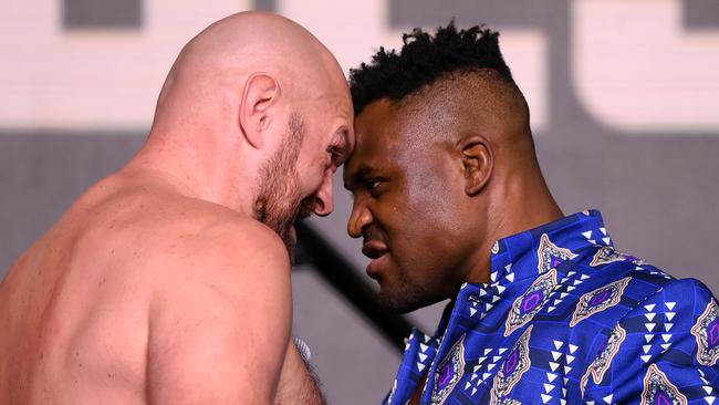 Tyson Fury and Francis Ngannou face off before their boxing fight. (Photo by Justin Setterfield/Getty Images)