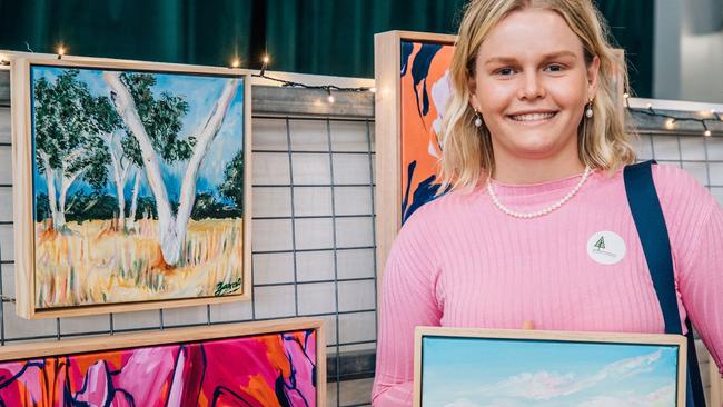 Artist Zarabella Bambling with some of her artwork from Zarabella‘s Art Gallery at the Burnett Christmas Pop-Up.