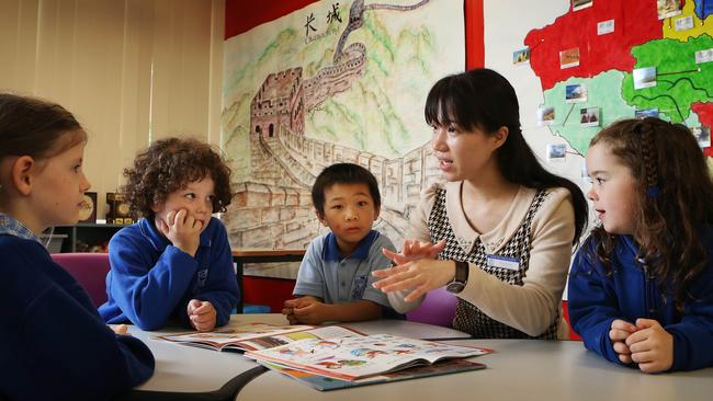 L to R..Rouse Hill Kindergarten students..Keshia McCormack, Benji Little, Elliot Fang, teacher, Elva Lee and Lily Brian learn Mandarin. NSW Premier, Mike Baird wants all NSW kids to learn an Asian language and plans to introduce it in to the state curriculum. It is going to start with kindergarten kids and then be rolled out across all years. Rouse Hill Primary School already has Mandarin lessons for its kids. Under Baird's plan, teachers from China will come to NSW and teachers from NSW will go to China.