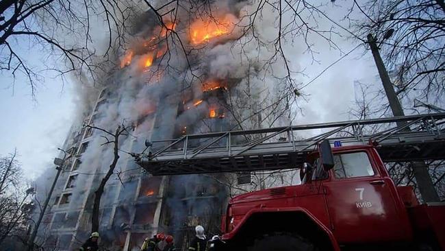 Firemen work to extinguish a fire in a housing block hit by shelling in the Sviatoshynsky district in western Kyiv, Ukraine. Picture: State Emergency Service of Ukraine / AFP