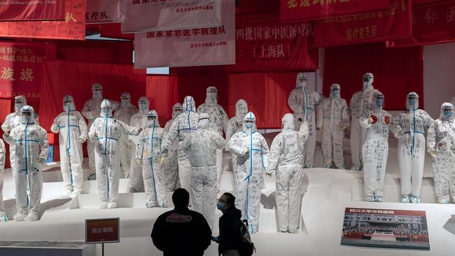 An exhibition about China’s fight against the COVID-19 pandemic at a convention centre that was previously used as a makeshift hospital for patients in Wuhan Picture: AFP