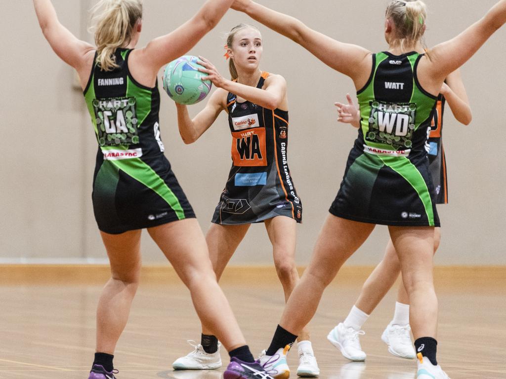 Sarah Joyce (centre) of Carina Tigers against Darling Downs Panthers in Queensland Ruby Series round eight netball at Downlands College, Saturday, June 3, 2023. Picture: Kevin Farmer