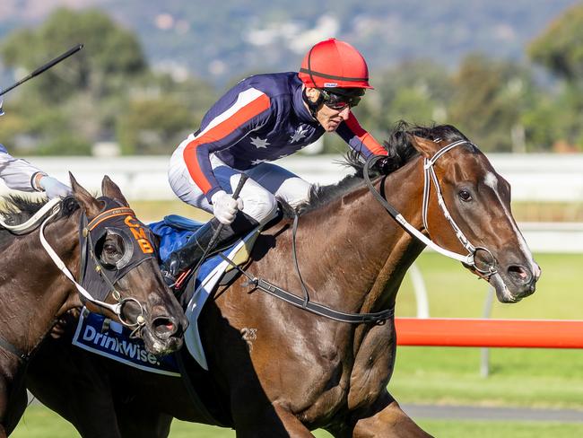 Jason Holder aboard Air Assault staves off Warmonger in the Listed Port Adelaide Guineas. Picture: Makoto Kaneko