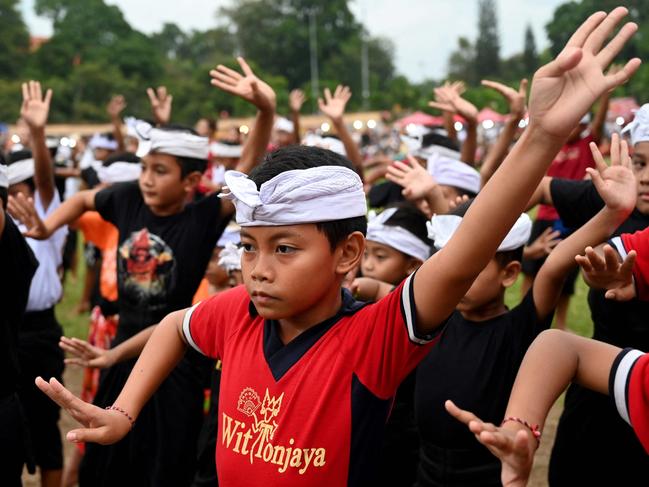 Children perform a traditional Balinese dance to release the sun of 2024, and to welcome the sun of 2025, during a New Year's Eve celebration in Denpasar, Bali. Picture: AFP