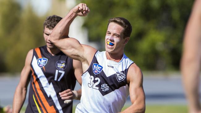 Tom Wilkinson celebrating after kicking a goal in the Southport Sharks' win over Northern Territory Thunder. Picture credit: TJ Yelds, NEAFL.