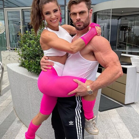Hemsworth and wife Elsa Pataky. What, you think you’d wear sleeves if you had arms like that?