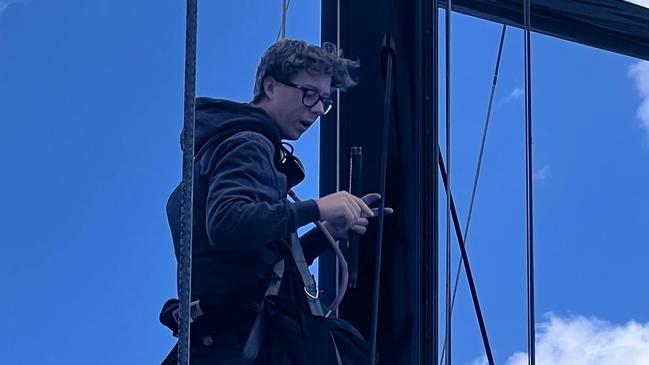 Charlie Goodfellow checking the mast in Hobart. Picture supplied: Deborah Wallace