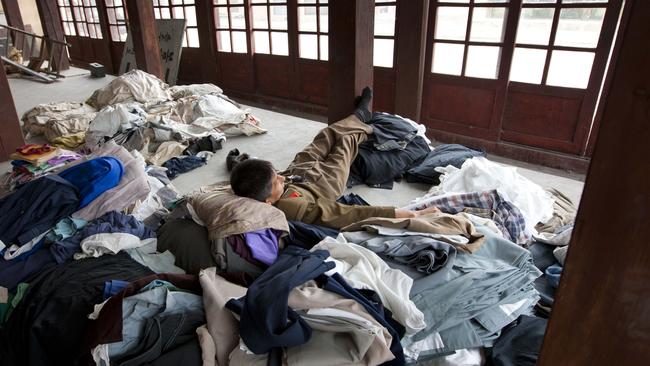 A film worker takes a break in the wardrobe department.