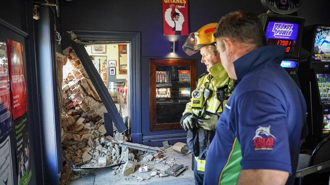 Owner Sam Ferguson assesses the damage to his Port Rd pub. Picture: AAP/Mike Burton