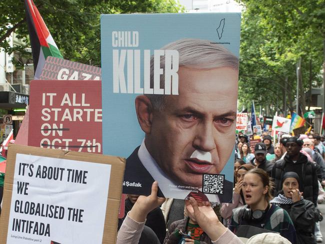 Protesters hold signs comparing Benjamin Netenyahu with Hitler. PICTURE: Nicki Connolly