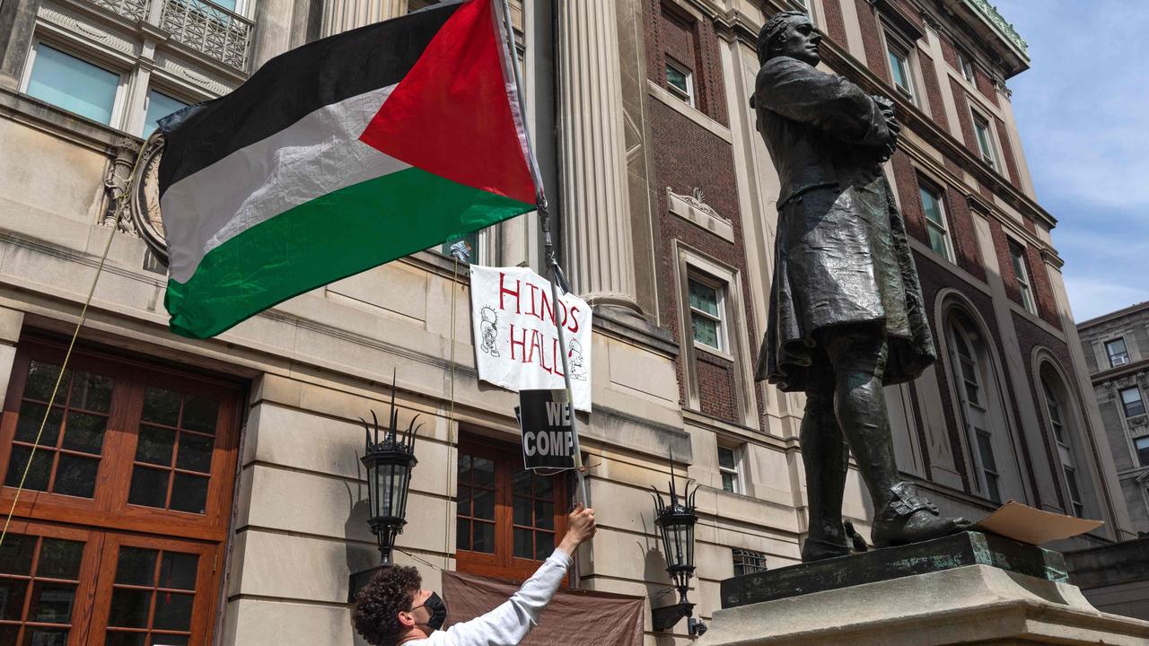 Pro-Palestinian student protesters wave a Palestinian flag. Picture: Emily Byrski / AFP