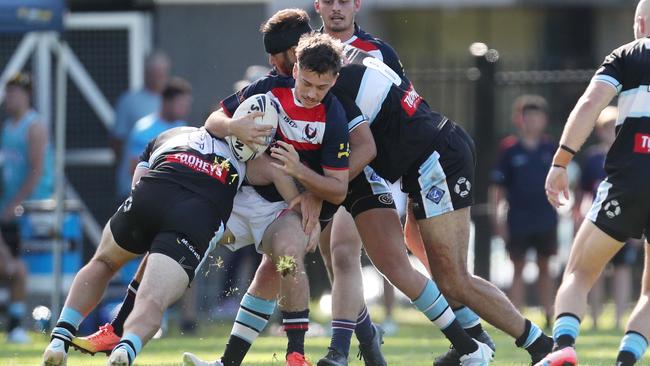 Erina’s Riley Burke held in a tackle. Picture: Sue Graham