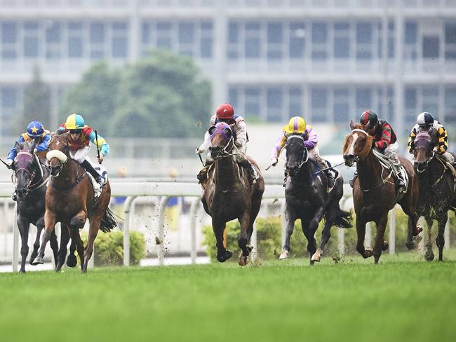 Chad Schofield pilots Ambitius Champion (second left) to victory in the The Queen Mother Memorial Cup. Picture: Getty Images