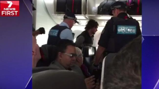 Air Canada flight interrupted in Brisbane as man tries to open door ...