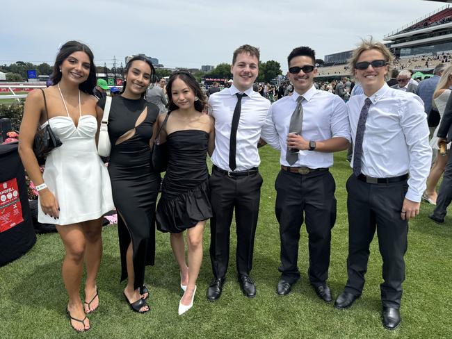 Amalia Mylonas, Bianca Careri, Lucy Kim, Tannin Wilson, Elmo Zographos and Jezz Petrincic at Flemington for Derby Day on November 2, 2024. Picture: Phillippa Butt