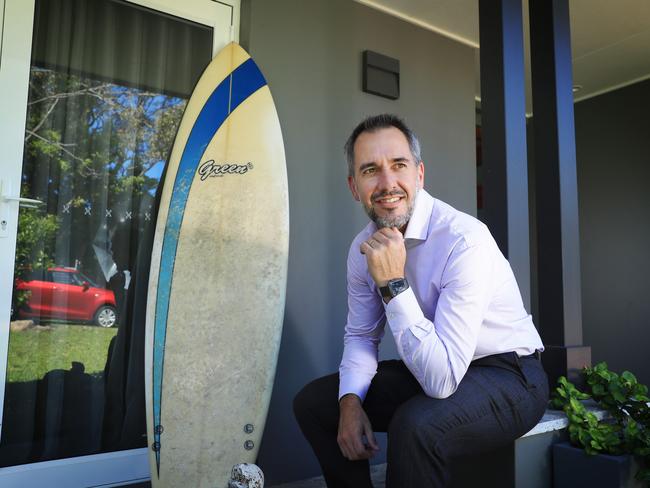 9/2/22: Brett Morgan at home on the northern beaches with his surfboard. Brett is the new CEO at MyState Bank. A fast growing Hobart based lender. John Feder/The Australian.