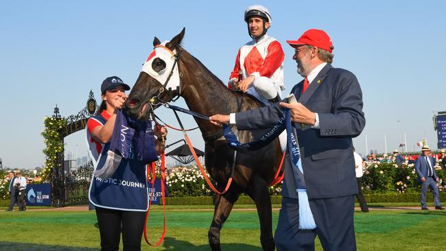 Anthony Darmanin riding Mystic Journey and owner Wayne Roser after winning in Race 8, The All-Star Mile at Flemington Racecourse on March 16, 2019 in Melbourne. Picture: Vince Caligiuri/Getty Images