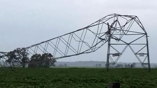 A transmission tower carrying power lines, toppled by high winds near Melrose in South Australia. Picture: Debbie Prosser/AFP