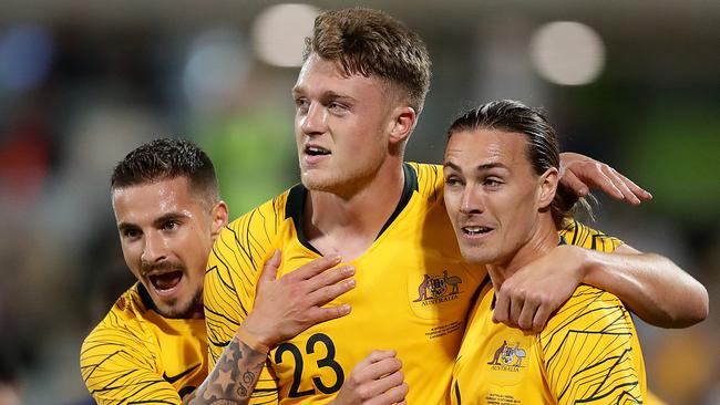 CANBERRA, AUSTRALIA - OCTOBER 10: Harry Souttar of the Socceroos celebrates scoring a goal with team mates during the FIFA World Cup Qatar 2022 and AFC Asian Cup China 2023 Preliminary Joint Qualification Round 2 match between the Australian Socceroos and Nepal at GIO Stadium on October 10, 2019 in Canberra, Australia. (Photo by Mark Metcalfe/Getty Images)