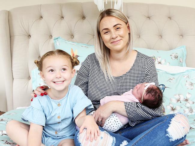 Blue Mountains mum Taylor Oldfield with her daughters Cali 2, and newborn Bronte, who will get her first immunisation shots in a month. Picture: Tim Hunter.