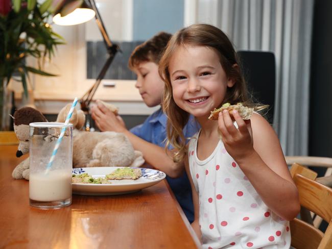 Pictured having breakfast at home is Charlie Clarkin (5) ahead of getting ready for her first day of Kindergarten at Marist Catholic School in North Sydney.Picture: Richard Dobson