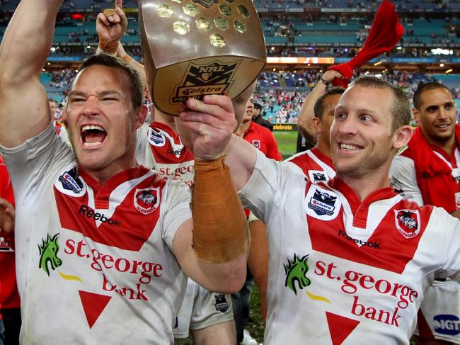 03/10/2010 NEWS: NRL- Grand Final Sydney Roosters v St.George Illawarra Dragons at ANZ Stadium. Dean Young and Ben Hornby leave the field with the NRL trophy .