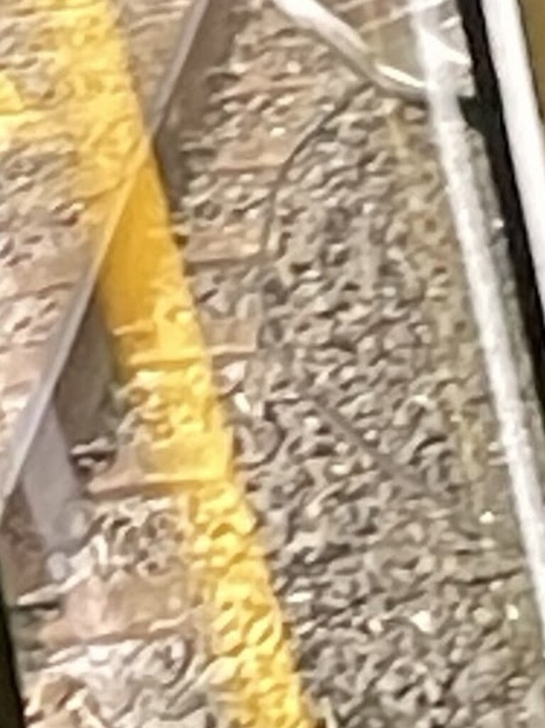 What appears to be a wire across the tracks.