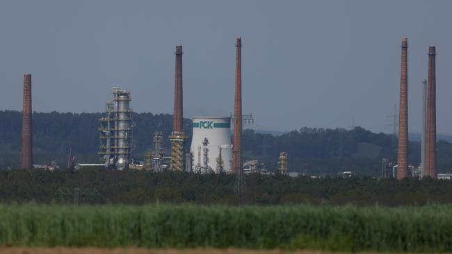 The PCK oil refinery stands behind a farmer's field n Schwedt, Germany. The PCK refinery is majority owned by Russian energy company Rosneft and receives 100% of its oil from Russia through the Druzhba pipeline. The German government, in order to punish Russia for its ongoing war in Ukraine, has vowed to bring Russian oil imports down to zero. Picture: Sean Gallup/Getty Images