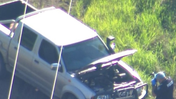 Police are searching for the driver of a car who fled the scene of a horrific crash involving a motorbike south of Brisbane on Sunday. Picture: 7 News