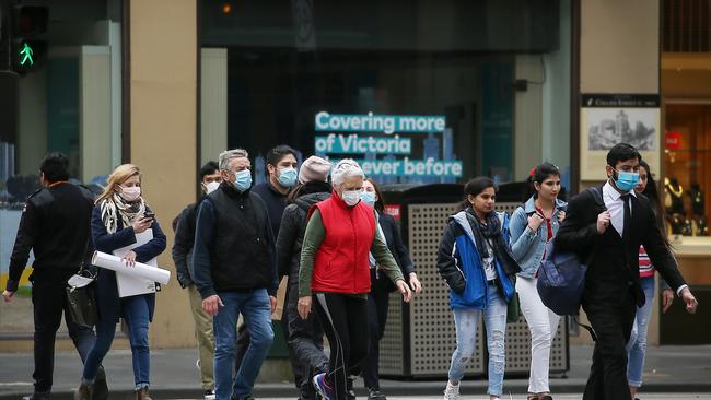 Victorians are taking up the recommendation to wear masks in public. Picture: Ian Currie/NCA NewsWire.