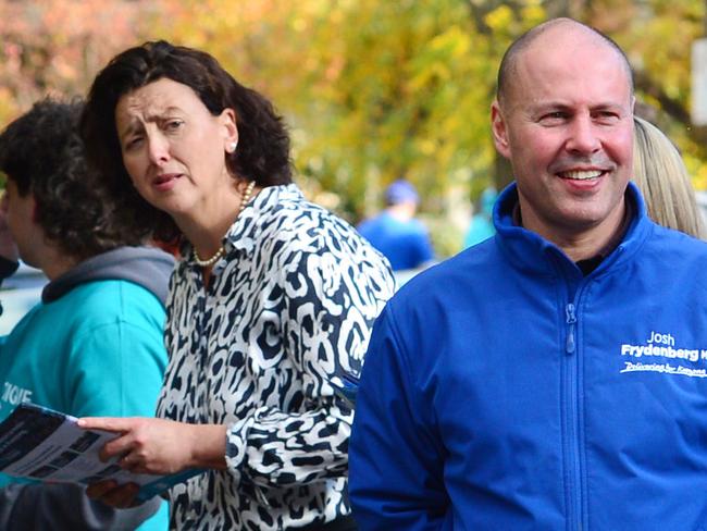 MELBOURNE, AUSTRALIA - NewsWire Photos MAY 9TH, 2022 :  Australian Federal Treasurer Josh Frydenberg visits the pre-polling booth in Hawthorn, Melbourne, with former Premier of Victoria Ted Baillieu and independent candidate Monique Ryan behind. Picture : NCA NewsWire / Nicki Connolly