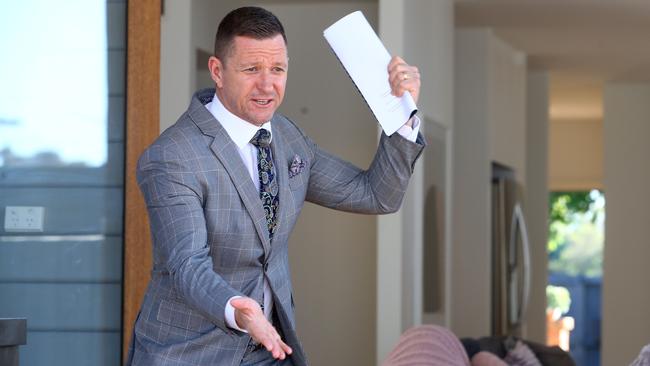 Auctioneer David Cortous at work in Newtown, inner-western Sydney, before his industry was hit with restrictions. Picture: Glenn Ferguson