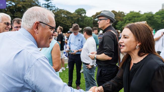 Former prime minister Scott Morrison and Senator Jacqui Lambie shaking hands at the rally. Picture: NCA NewsWire / David Swift