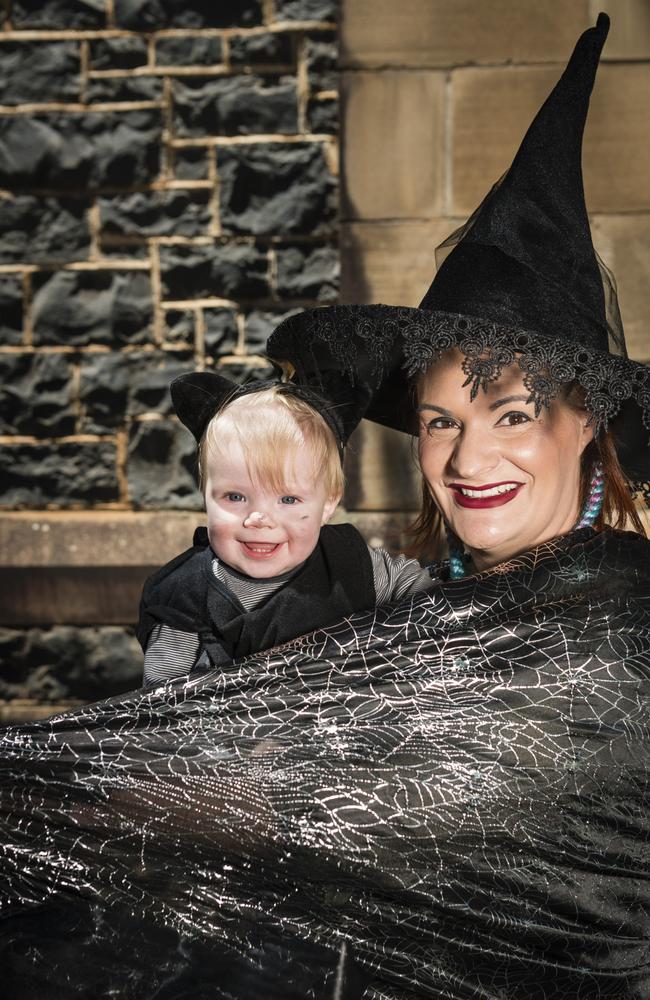 Primrose (left) and Amber Willmot play Witchcraft and Wizardy CluedUpp game in the Toowoomba CBD. Picture: Kevin Farmer