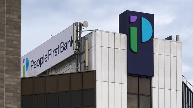 Heritage Bank head office building in Ruthven St now displays the merged rebranded name of People First Bank, Friday, June 21, 2024. Picture: Kevin Farmer