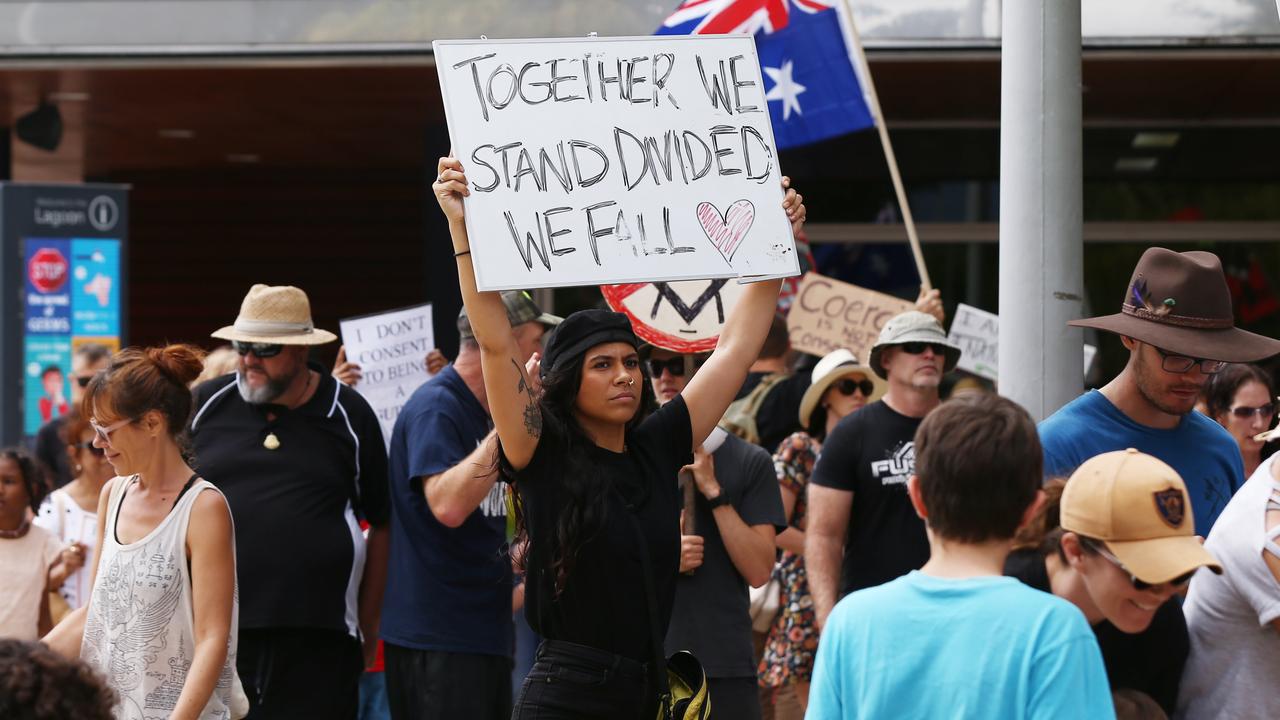 A Freedom Rally was held on the Esplanade north of Muddy's on Saturday, before around 700 supporters marched down the Esplanade and past the children's playground, down to the lagoon and back. Janelle Raumati of Smithfield carries a message along the march. PICTURE: Brendan Radke