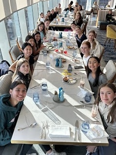 The girls having breakfast after their stay.