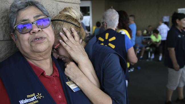 Walmart employees react after an active shooter opened fire. Picture: AP