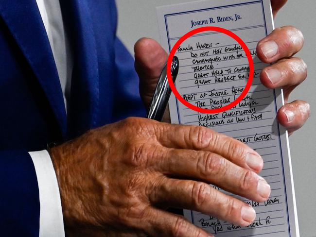 US Presidential candidate and former Vice President, Joe Biden holds a pad with potential Vice Presidential names on it and other notes, during a campaign event at the William "Hicks" Anderson Community Center in Wilmington, Delaware on July 28, 2020. (Photo by ANDREW CABALLERO-REYNOLDS / AFP)