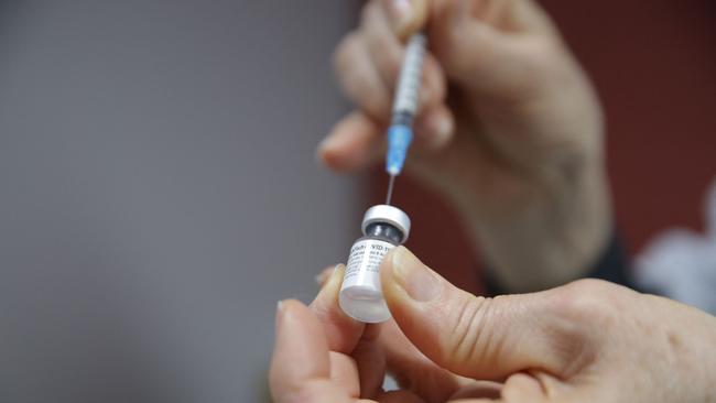 Greg Hunt’s announcement will give thousands of businesses the confidence to get on with the task of aiding the vaccine rollout effort. Picture: AFP