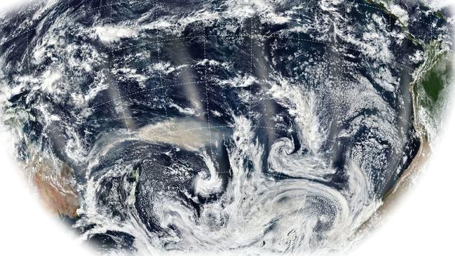 The smoke plume from Australia’s wildfires earlier this year, shown at centre left in this composite satellite image, soared to a record 21 miles high in the stratosphere and circled the globe twice. This image was recorded on Jan. 6 by the Suomi National Polar-Orbiting Partnership satellite. Photo: NASA Earth Observatory