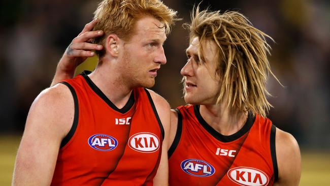 Essendon’s Aaron Francis and Dyson Heppell.