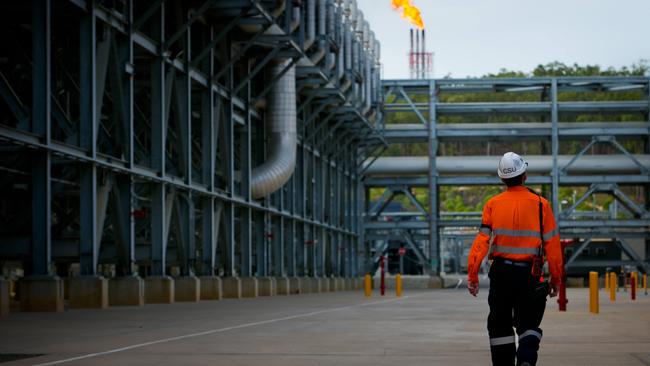 A worker walks through the Queensland Curtis Liquefied Natural Gas (QCLNG) project site. Picture: Bloomberg