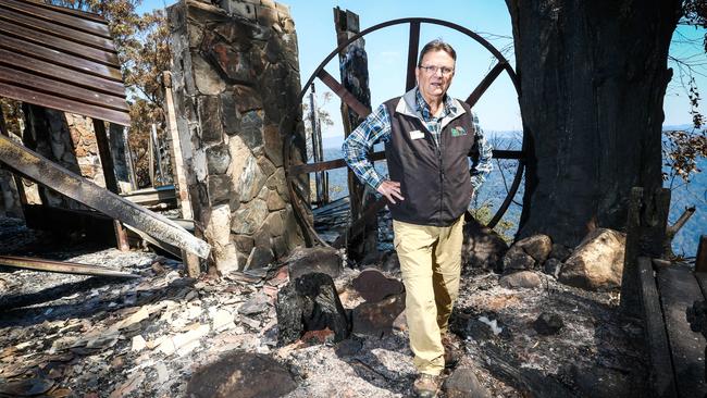 Binna Burra Lodge's Steve Noakes surveys the ruins of part of the lodge. Picture: Nigel Hallett