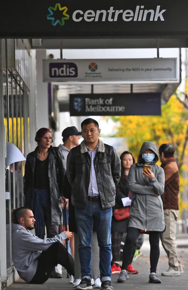 People queued outside a Centrelink office in Melbourne in April. Picture: William West / AFP